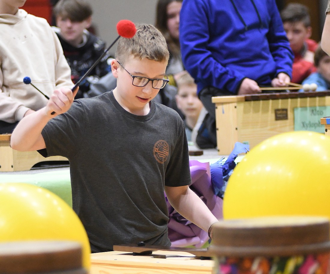 Sixth grader Fletcher Post is poised to play the bass bar last week during rehearsal for Bloomfield Elementary School’s spring program. (The Commercial Review/Ray Cooney)