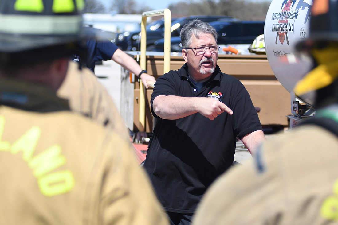 Ron Huffman of Responder Training Enterprises explains aspects of safely dealing with propane leaks to firefighters from the Portland, Redkey and Bryant departments during a training session Saturday afternoon. The training paid for by the Local Emergency Planning Committee also included new equipment to help handle propane emergencies. (The Commercial Review/Ray Cooney)