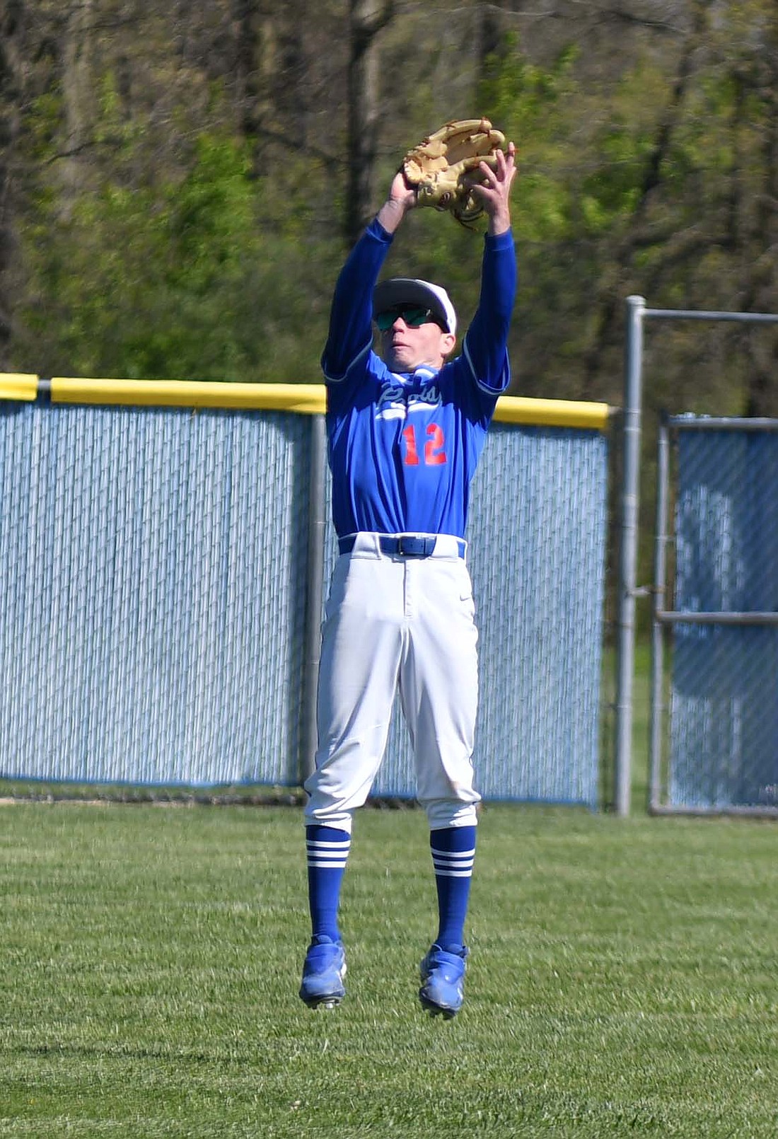 Cody Rowles, the centerfielder for the Jay County High School baseball team, leaps to catch a line drive during the Patriots’ 23-2 win over Randolph Southern on Saturday. (The Commercial Review/Andrew Balko)