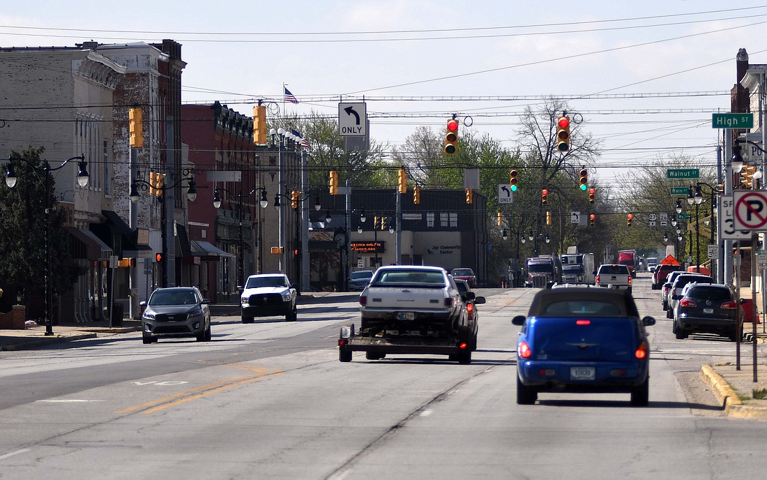 Meridian Street traffic lights (pictured looking south) at High, Walnut, Main and Water streets as well as at Lafayette Street will be removed next week as part of Indiana Department of Transportation’s project in Portland. Temporary four-way stop signs will be placed at the intersection of Meridian and Water streets. The other intersections involved will be two-way stops. The project includes installing new traffic signals, constructing new sidewalk ramps and paving Meridian Street. (The Commercial Review/Ray Cooney)