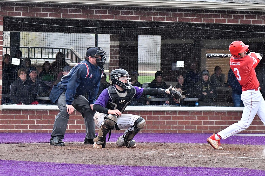 Fort Recovery High School senior Riggs Tobe frames a pitch from Alex Dues in Tuesday’s 2-0 win over St. Henry. (The Commercial Review/Andrew Balko)