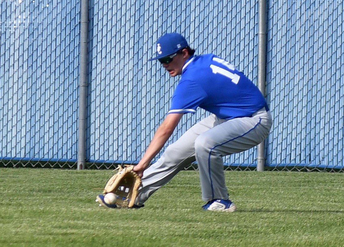 Aiden Phillips fields a ground ball in right field during the Patriots’ 11-1 victory over the Muncie Central Bearcats on Monday. Jay County faced off with the winless Bearcats to build some confidence after having to play the Class 2A No. 1 Hagerstown Tigers over the weekend. (The Commercial Review/Andrew Balko)