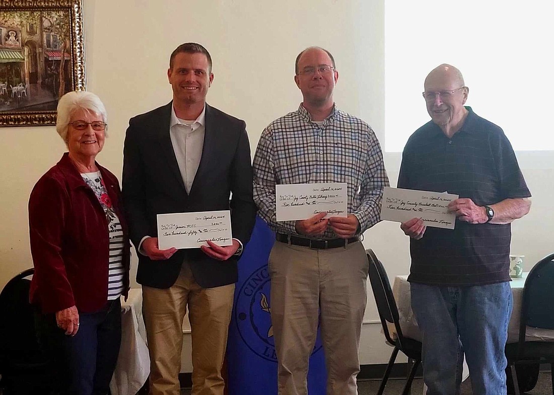 Cincinnatus League recently presented checks to several organizations. Pictured are Julia Schwomeyer of Cincinnatus League, Drew Houck representing the Junior Reserve Officers' Training Corps (ROTC), Eric Hinderliter, Director of the Jay County Public Library, and Bob Vance representing the Jay County Baseball Club. (Photo provided)