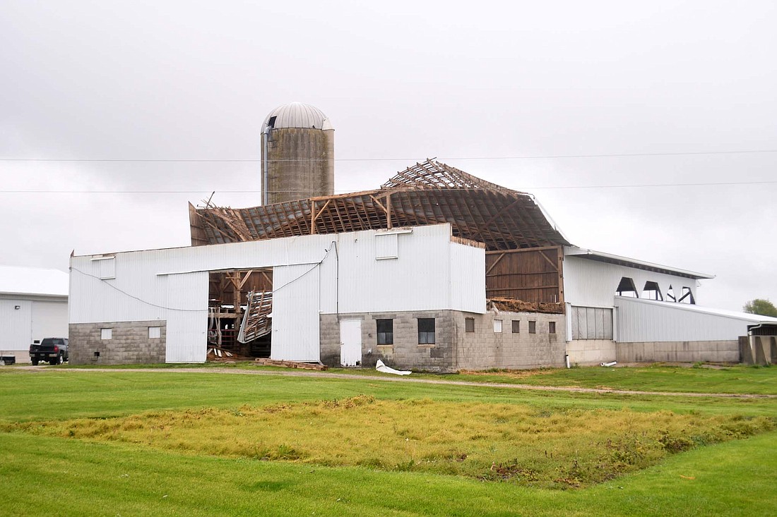 A tornado that blew through Mercer County on Tuesday evening destroyed several barns and other farm structures and caused roof damage to some homes. Pictured above, a roof is partially torn off of a barn at 1401 Ohio 219. (The Commercial Review/Ray Cooney)