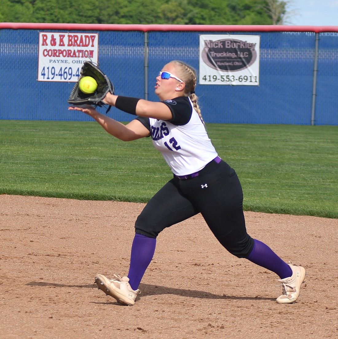 Ava Grisez, a junior at Fort Recovery High School, catches a line drive to record the second out of a potentially dangerous inning for the Indians during the Division III sectional championship on Friday night. Grisez played a large role in an offensive explosion late in the game that led the Indians to a 10-2 sectional title over the Wayne Trace Raiders. (The Commercial Review/Andrew Balko)