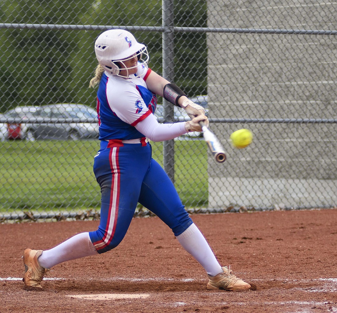 Jay County High School senior Riah Champ connects for a double Friday night during the Patriots’ 10-0, five-inning win over Southern Wells. JCHS was up 9-0 in the bottom of the fifth inning when Champ hit the double. She came around to score the game-ending run. (The Commercial Review/Ray Cooney)