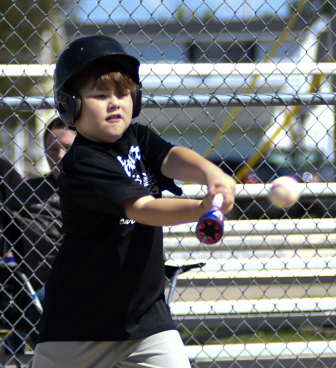 Drea Perez of Barnett’s swings for a hit during his team’s Portland Junior League game Saturday against Cook’s Nursery. Portland Junior League celebrated its opening day of the season Saturday. (The Commewcial Review/Ray Cooney)
