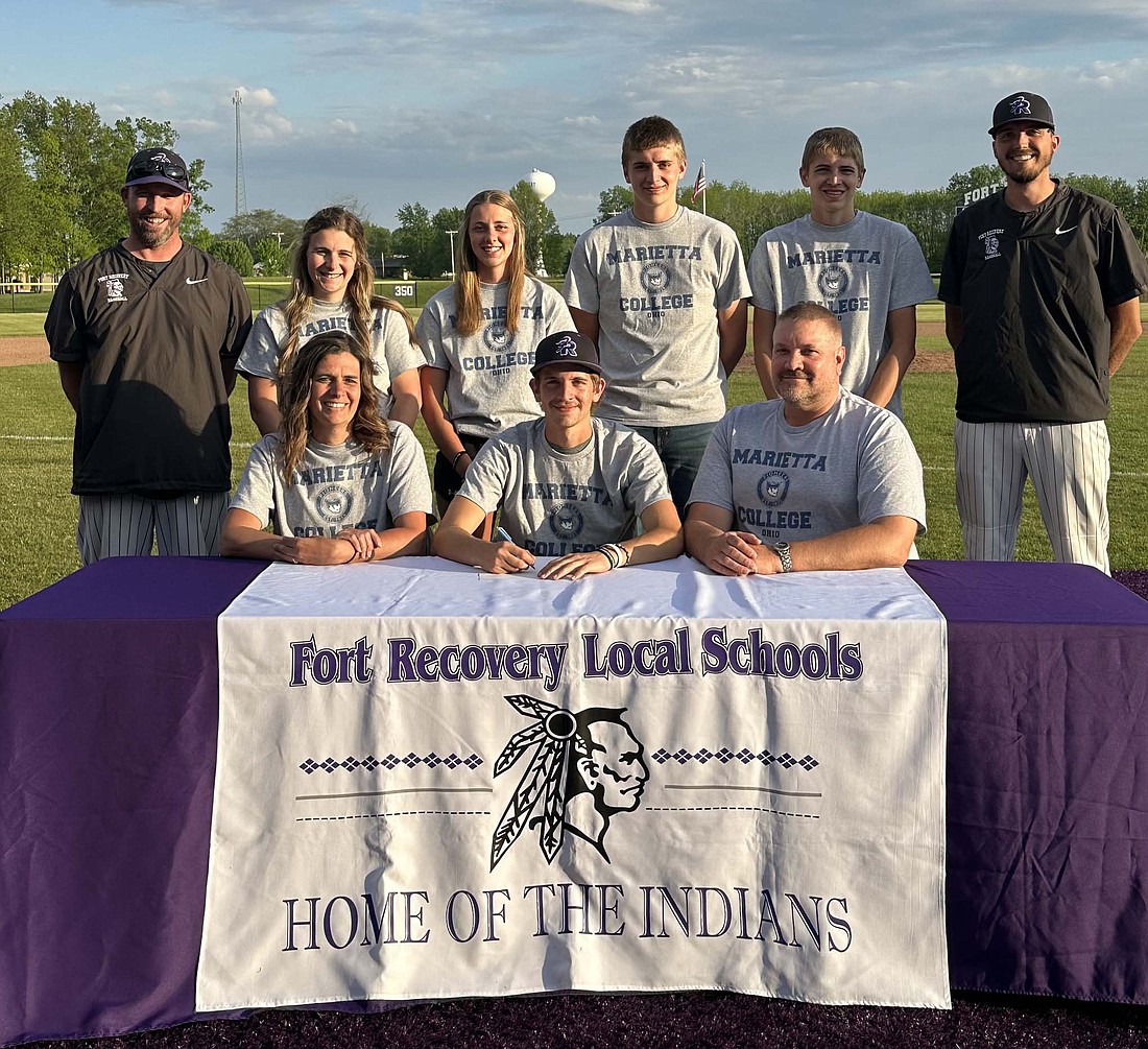 Alex Dues signed to play baseball at Marietta College on Monday afternoon. Pictured from left to right in the front row are mother Jenny Dues, Alex and father Nick Dues. Back row are coach Kevin Eyink, sisters Maleia and Kylia, brothers Brennan and Jordan and assistant coach Ben Homan. (Photo provided)