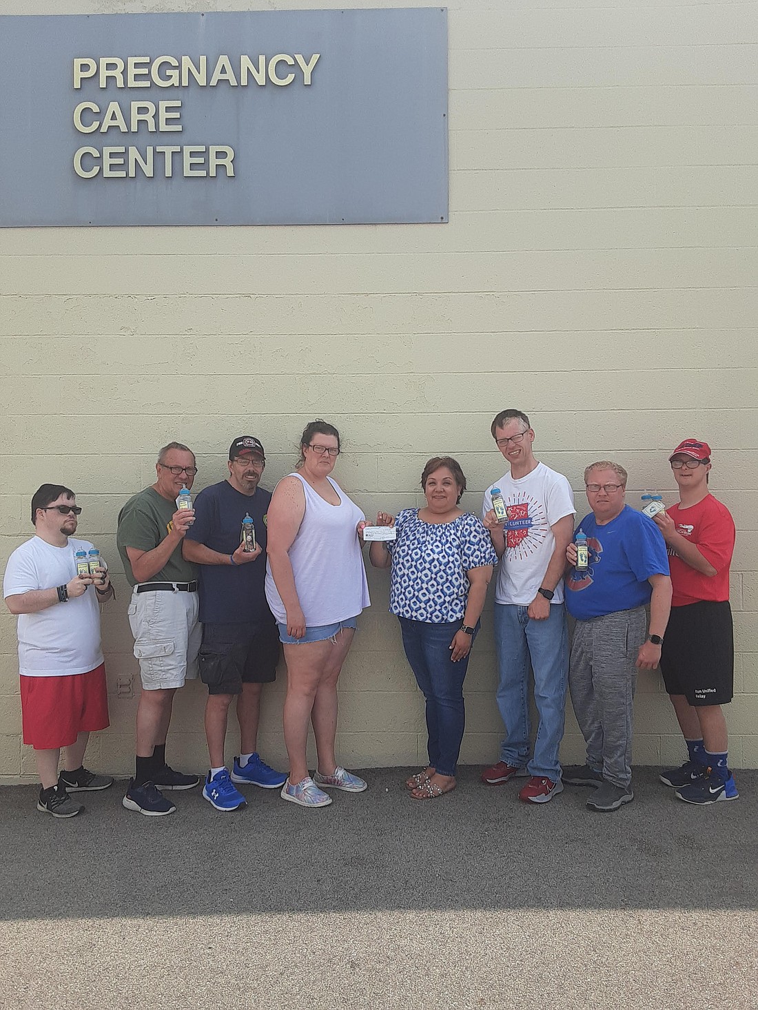 Mighty Marvels Optimist Club made a $1,200 donation May 6 to the Pregnancy Care Center of Jay County. Pictured from left are club members Cory LeMaster, Ron Smith, Sam Glessner and club president Michelle Hostetler, Pregnancy Care Center executive director Lisa Peterson and club members Randy Lucas, Kurtis Atkinson and Kameron Woodbury. (Photo provided)