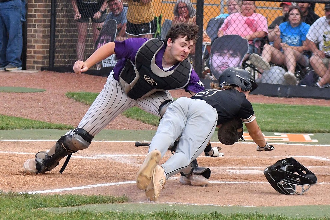 Fort Recovery High School catcher Riggs Tobe attempts to lay a tag on Parkway’s Kolt Harner in the third inning of the OHSAA District III opener at Coldwater on Wednesday. Tobe couldn’t hold onto the ball, letting the Panthers score, but the Indians found a way to comeback late for a 12-8 victory. (The Commercial Review/Andrew Balko)
