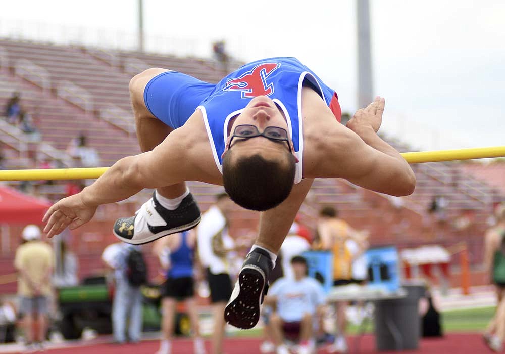 Jay County High School's Adam Alig competes in the high jump during Thursday's boys track regional meet at Pike in Indianapolis. Alig was the only Patriot to advance to the regional. (The Commercial Review/Ray Cooney)