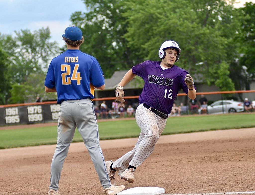 Fort Recovery High School senior Riggs Tobe rounds third base in the fifth inning of Friday’s Division IV district championship between the Indians and Marion Local Flyers. Tobe scored all the way from first base on a standup triple that Alex Dues crushed during the seven-run inning. (The Commercial Review/Ray Cooney)