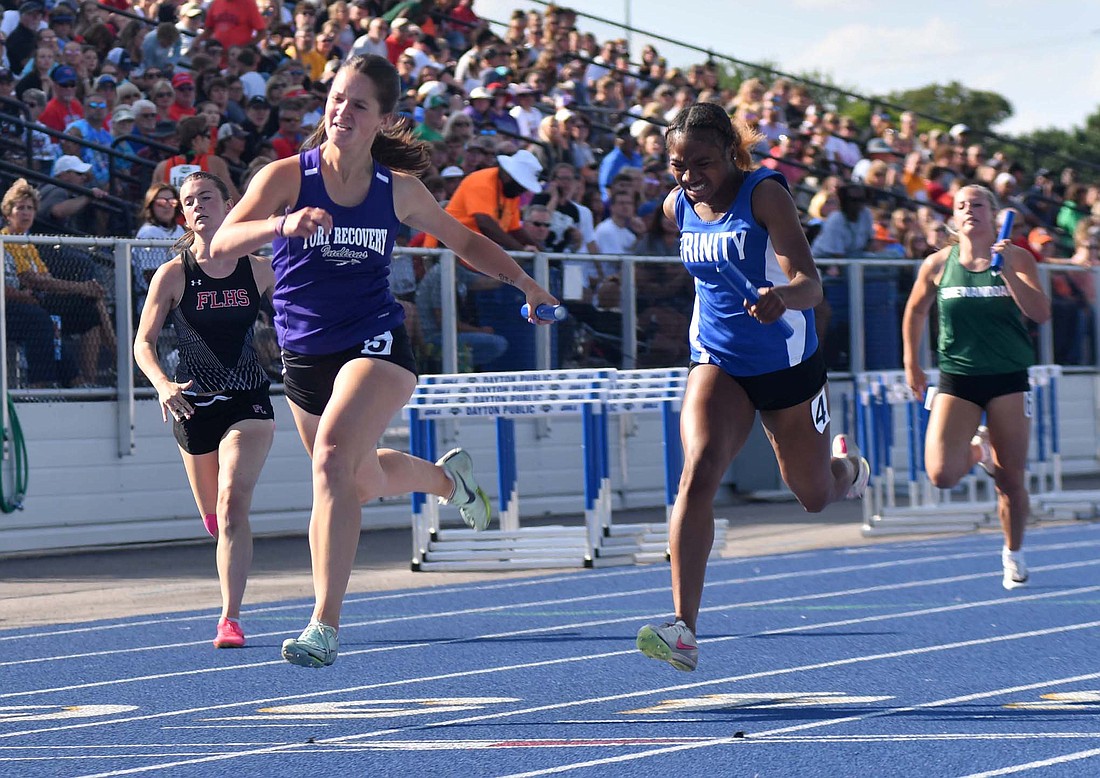 Fort Recovery High School's Mara Pearson crosses the finish line first in the 4x100-meter relay during the preliminary race for the OHSAA Division III state track and field tournament on Thursday at Welcome Stadium in Dayton. The Indians earned the second seed in the event, only trailing West Liberty-Salem by 0.41 seconds (The Commercial Review/Andrew Balko)