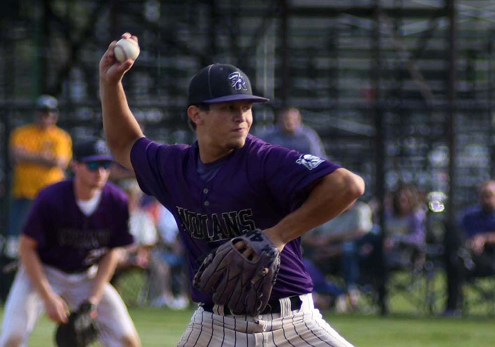 Caden Grisez, a junior at Fort Recovery High School, hurls a pitch during the Indians’ 5-1 victory over Leipsic in the OHSAA Division IV regional finals on Friday. Grisez went the distance on the mound for the Indians and struck out five batters in a row over in the first and second innings. (The Commercial Review/Ray Cooney)