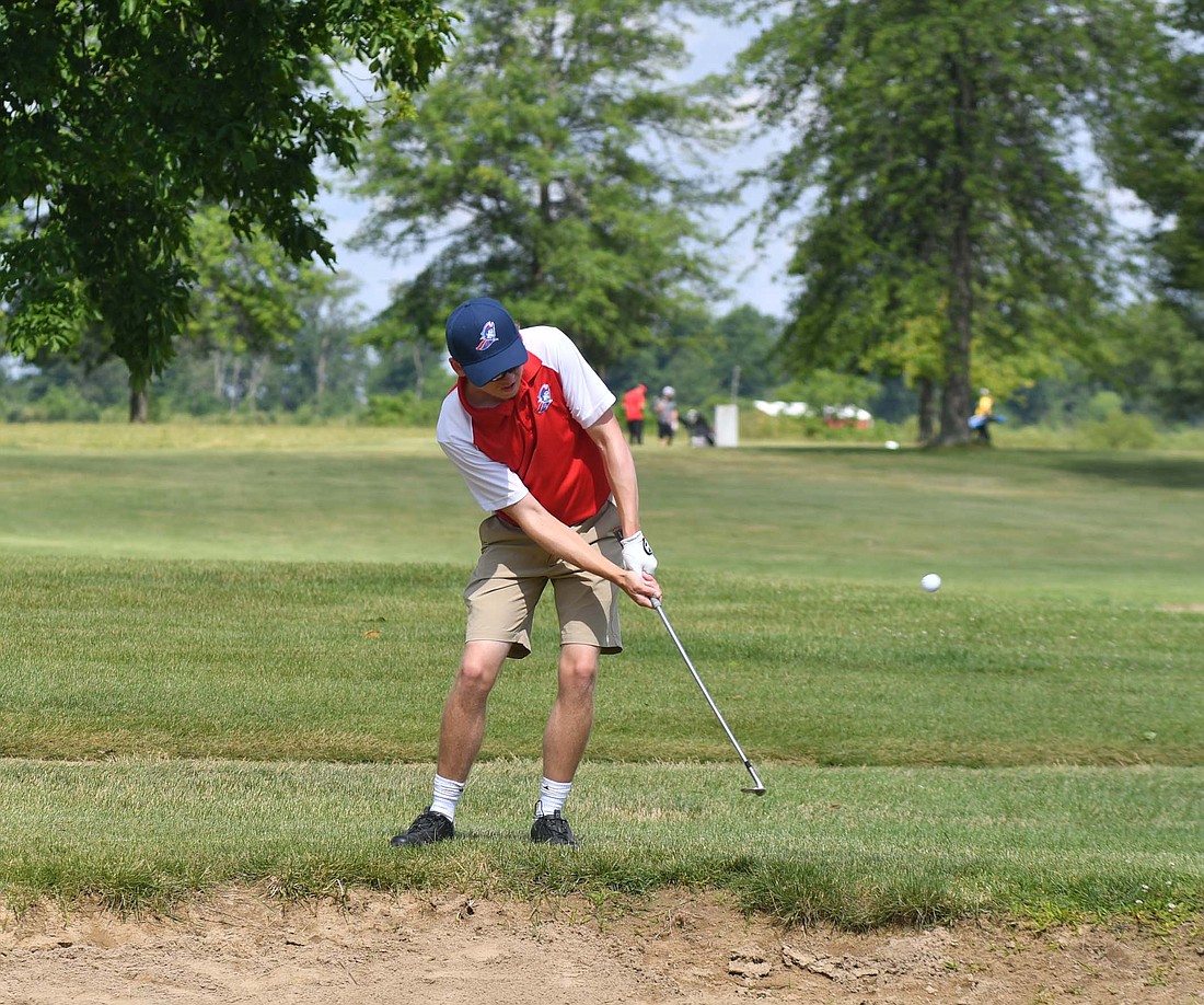 Caleb DeRome of Jay County High School chips onto the green on the seventh hole at Hickory Hills Golf Course during the IHSAA Sectional 19 meet. DeRome shot one of his only bogeys of the day on the hole, during his performance that earned the Patriots their first sectional medalist. (The Commercial Review/Andrew Balko)