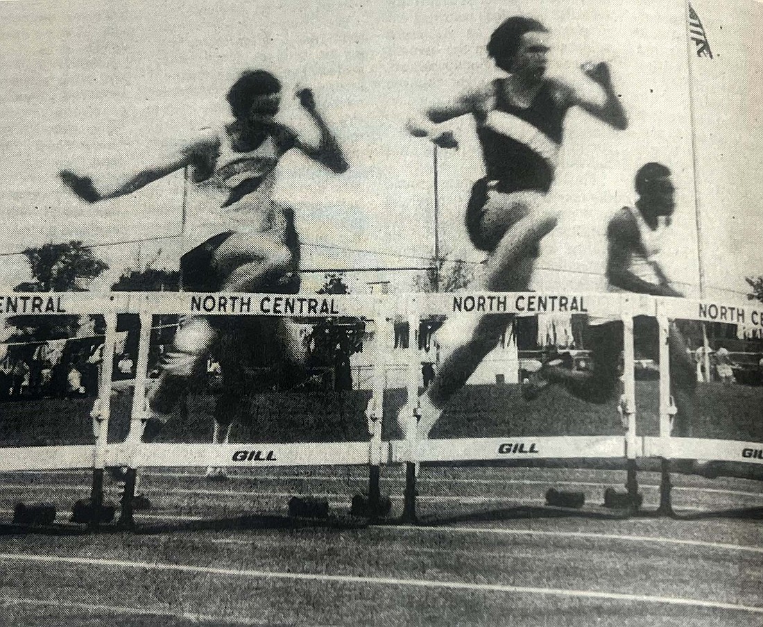 Dunkirk runner Jeff Brown skims the low hurdles during the finals at the regional high school track and field meet at Indianapolis North Central, which he set a new regional record in 1974. One week later, Brown was awarded the Hinshaw Mental Attitude Award. (The Commercial Review/Mark Mann)