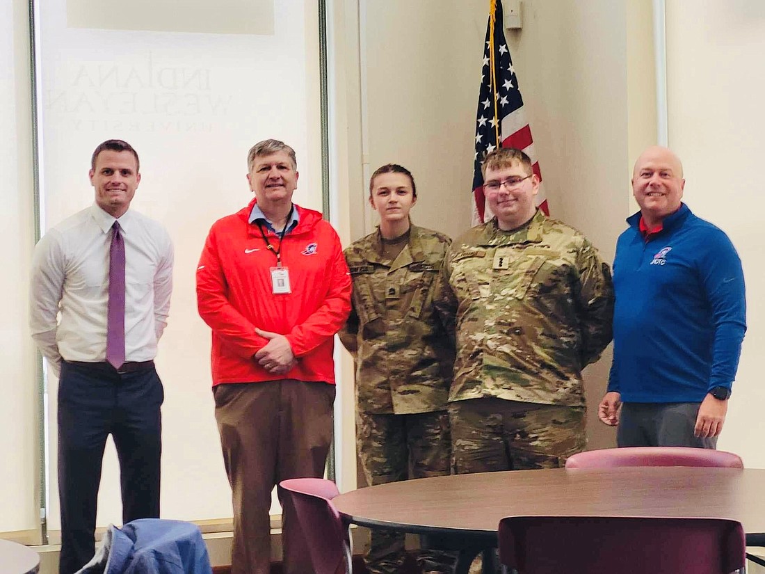 Portland Rotary Club Youth Services teamed up with Junior Reserve Officers’ Training Corp at Jay County High School this year to raise funds for constructing a JROTC obstacle training course at the high school. Plans are to practice and host other schools for competitions. The group raised $11,925 for the project, with Jay School Corporation contributing enough to bump the project to $20,000. Pictured above, from left, are youth services chair Drew Houck, Jay School Corporation superintendent Jeremy Gulley, Portland Rotary Club junior board members Desirae Bonefield and Trenton Franks, and JROTC instructor Steven Bishop. (Photo provided)