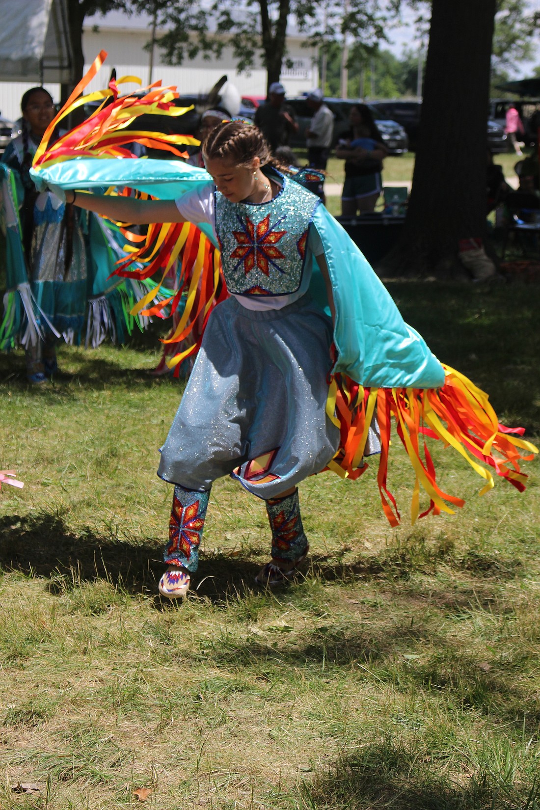 Brooklyn Cotterman, 13, twirls around Sunday during the Gathering of Great Lakes Nations Pow Wow at the Tri-State Grounds in Portland. (The Commercial Review/Bailey Cline)