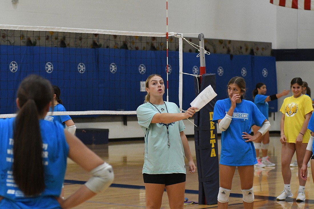 Pro Volleyball Federation player Kylie Murr, a Yorktown High School graduate, instructs athletes May 29 during the Pro Bro Camp at Delta Middle School. Murr, who finished up her season with the Vegas Thrill of the fledgling professional league earlier in the month, instructed on passing, setting, digging and defense. Attendees at the camp included a contingent of athletes from Jay County High School. (The Commercial Review/Ray Cooney)