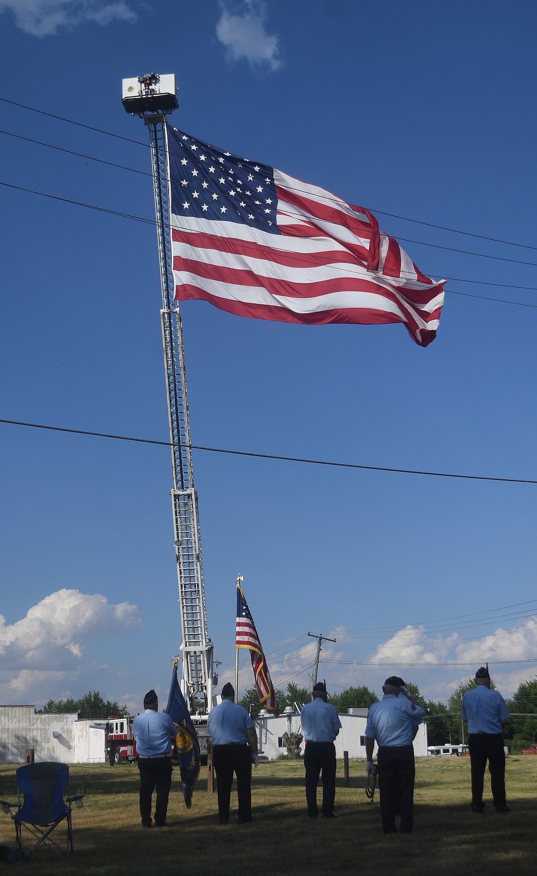 Members of the Portland American Legion Honor Guard stand at attention Friday evening during the Portland Elks Flag Day ceremony at Good-Rich Brewery in Portland. (The Commercial Review/Ray Cooney)