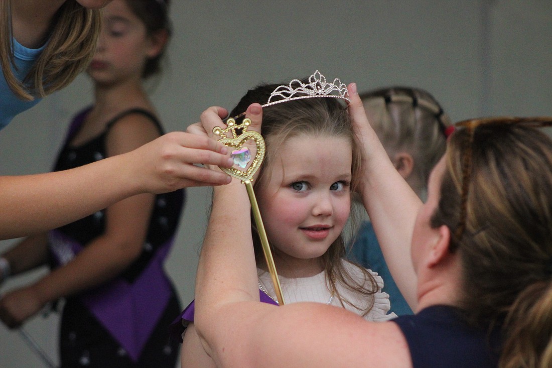 Fort Recovery Harvest Jubilee kicked off Thursday. Above, Charlie Brotherton, 4, is crowned as Little Miss of the Jubilee. (The Commercial Review/Bailey Cline)