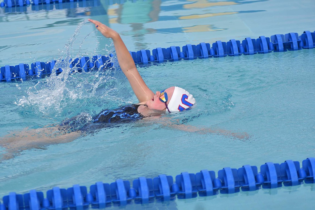 Jayden Guggenbiller swims the backstroke as the first leg of the 8-and-younger girls 100-meter medley relay for the Jay County Summer Swim team on Monday at Portland Water Park. Guggenbiller combined with Maddie Theurer, Layne Mann and Annabelle Wiggins for first place in the event to help Jay County to a 744-292 victory over the combined team Blackford and Marion. (The Commercial Review/Andrew Balko)