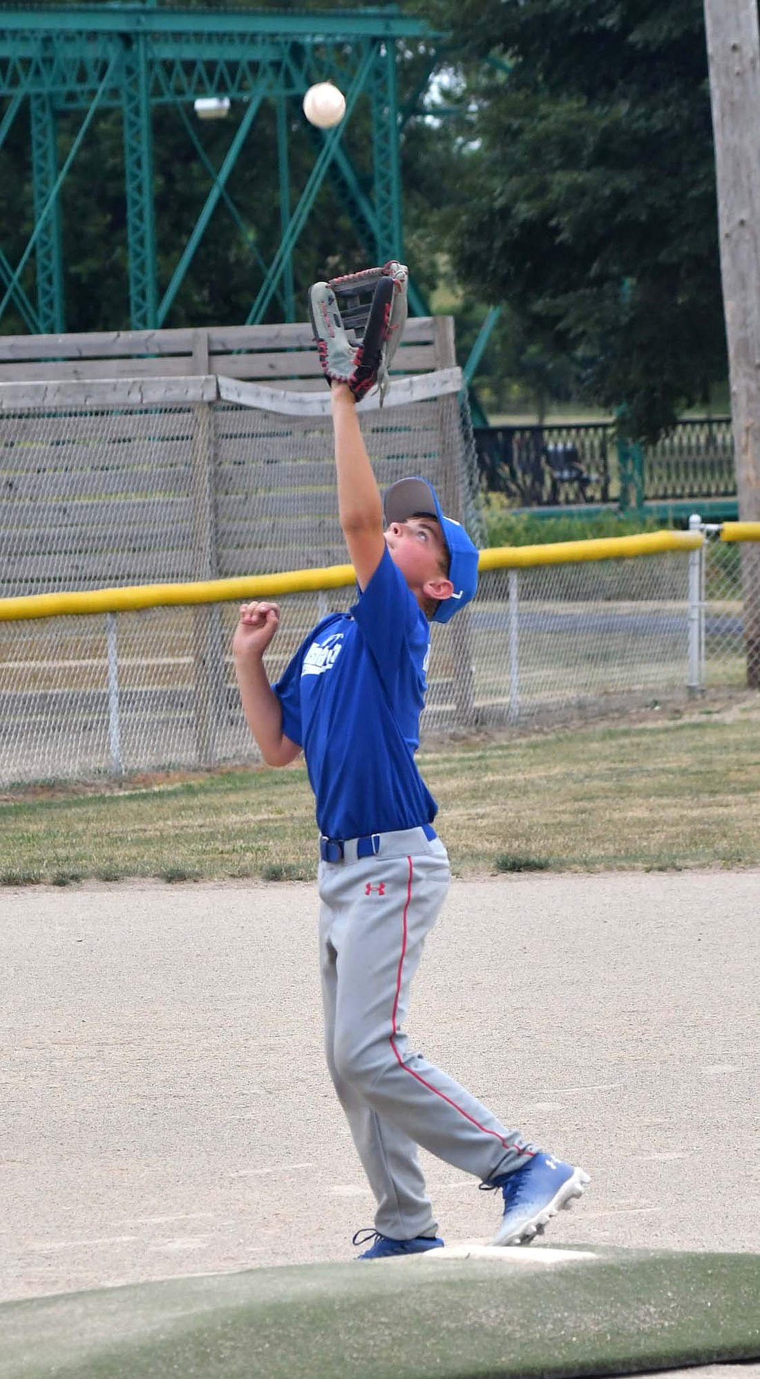 Display Craft pitcher Benton Langenkamp catches a short pop up on Tuesday against Lions Club in Portland Junior League Willie Mays baseball.  (The Commercial Review/Andrew Balko)