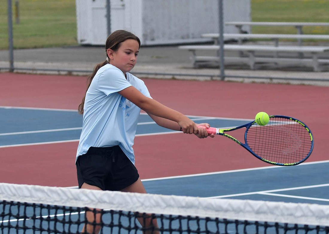 Kyla Sims hits a backhand during a drill that focused on footwork and movement at the Jay County High School tennis camp on Monday morning. (The Commercial Review/Andrew Balko)