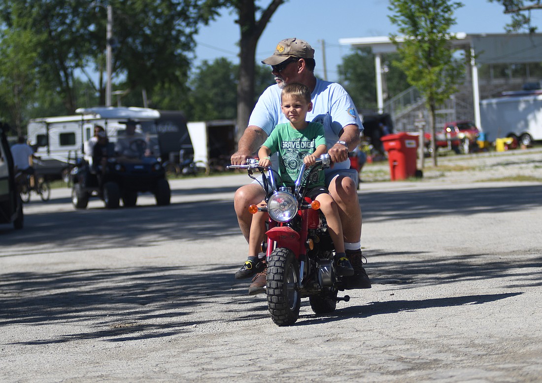 Visitors to the Vintage Motor Bike Show head east through Jay County Fairgrounds on Thursday morning. The event concludes today with a banquet at noon, a raffle beginning about 2 p.m. and a parade around the fairgrounds at 8 p.m. (The Commercial Review/Ray Cooney)