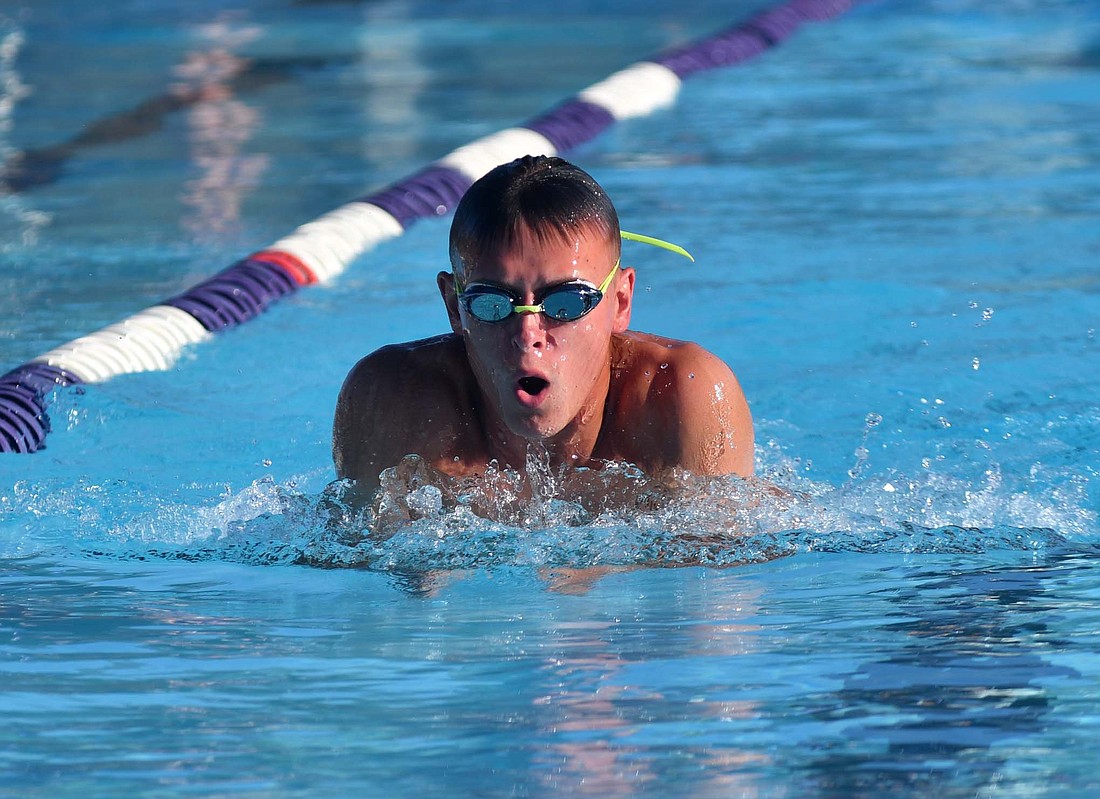 Lincoln Clamme swims the breaststroke leg of the 15-and-older 200-meter medley relay during the Jay County summer swim team’s meet at Fort Recovery on Monday. (The Commercial Review/Andrew Balko)