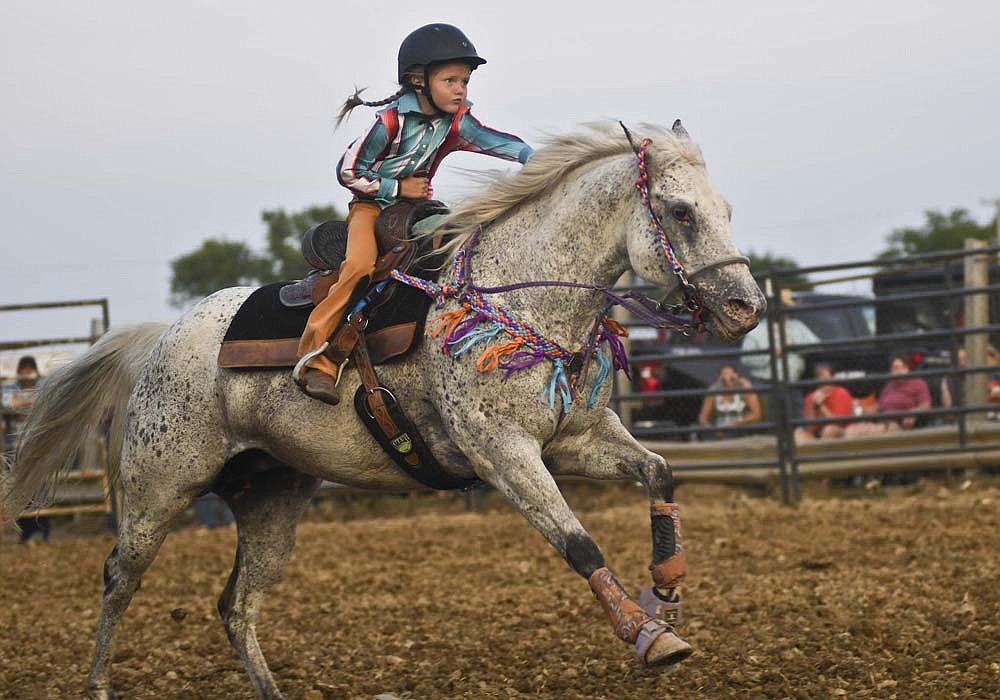 A girl competes as part of the 3 Bar J Rodeo during the 2023 Jay County Fair. Mike Johnson, a Jay County native, runs 3 Bar J out of Union City along with his wife Marcia, their daughter Mary Hanes and other family. The rodeo will return to the grandstand at the Jay County Fair for a show at 7 p.m. Tuesday. (The Commercial Review/Andrew Balko)