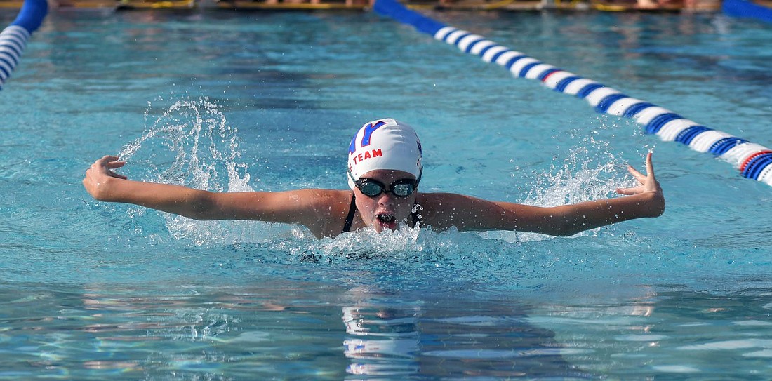 Carsyn Guggenbiller swims the butterfly stroke of the 9-10-year-old girls 100-meter medley relay for the Jay County summer swim team at Portland Water Park on Monday. Guggenbiller, along with Kynlee Homan, Lydia Hoevel and Addisyn Champ won the event to help Jay County to a 690-295 victory over Yorktown. Guggenbiller also secured first-place finishes in the 25 butterfly and 100 individual medley. (The Commercial Review/Andrew Balko)