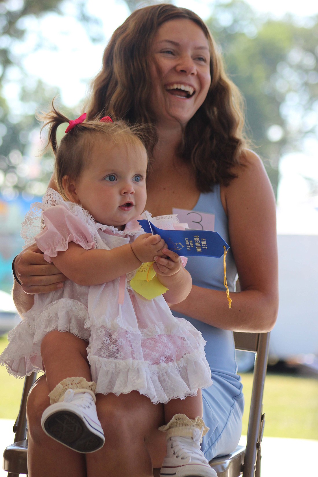 Jay County Fair’s baby contests July 6 yielded two overall winners. Pictured is the 6-to-12-month-old contest winner, Finley Inman, and her mother Pride Inman. (The Commercial Review/Bailey Cline)