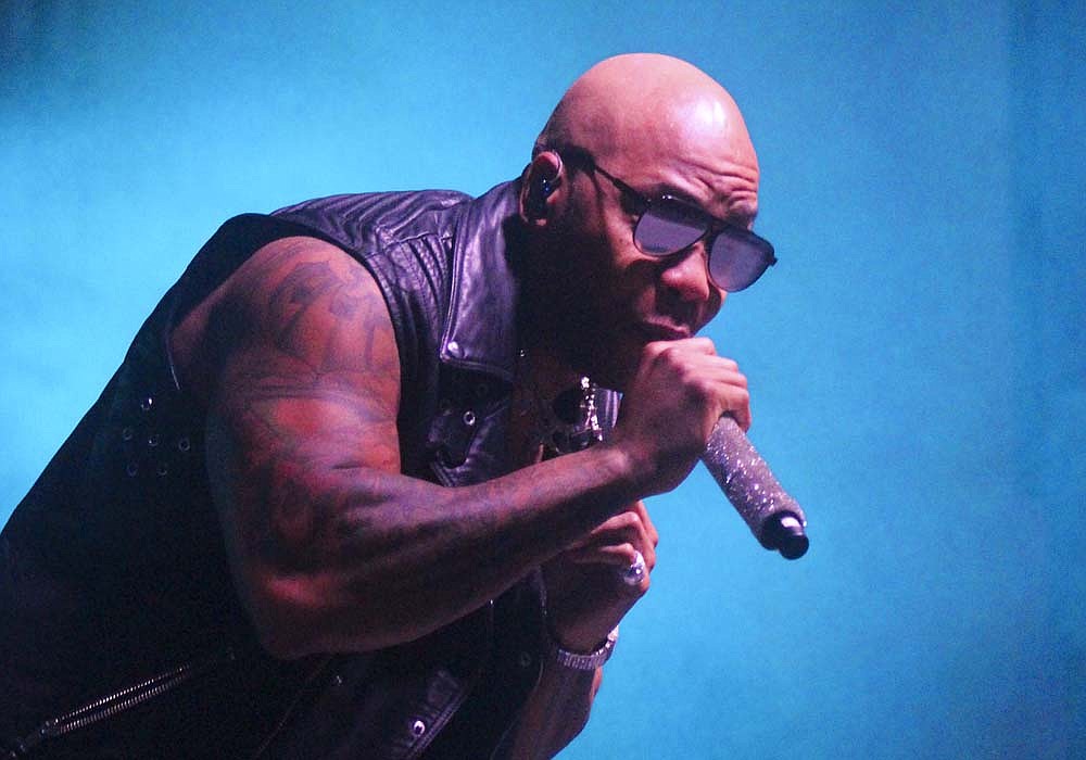 Flo Rida performs Friday night in front of the grandstands at Jay County Fair. The rap and R&B artist played many of his hit songs in front of a packed track. DJ Kronik opened the show. (The Commercial Review/Bailey Cline)