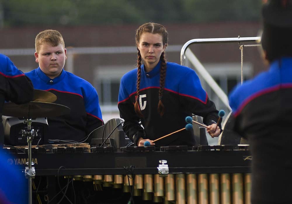 Percussionist Keira Corwin performs Saturday evening for the Jay County High School Marching Patriots during the Archway Classic at Centerville. JCHS scored 53.35 points to finish third at the event behind Richmond (57.35) and the host Blue Regiment (54.85). (The Commercial Review/Ray Cooney)