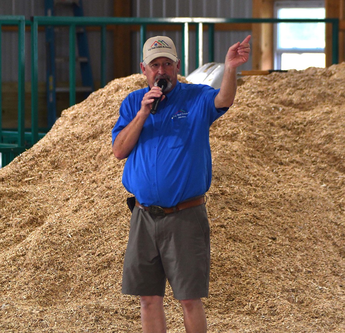 Gary Loy of Loy Real Estate and Auction closes a bid during the 4-H food auction at the Blackford County Fair on Monday evening. (The Commercial Review/Andrew Balko)