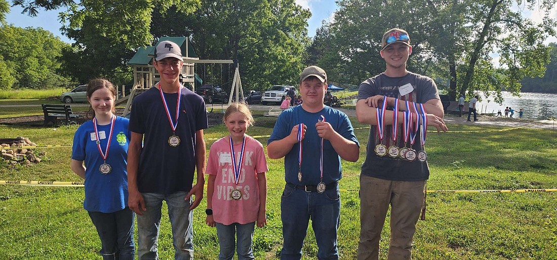 Jay County medal winners at the 30th Randolph County 4-H Shooting Sports Extravaganza. It was held on June 29th at Farmland Conservation Club.  Pictured left to right,  Claire Skirvin in 12 and under took second place in rifle.  Camden Buckland in 13 and up took first place in rifle.  Danielle Somers in 12 and younger took first place in Muzzle Loader.  Corey Emery in 13 and older took third place in pistol and second place in shot gun.  Morgan Davis in 13 and over took first place in pistol, second place in fishing, first place in archery, third place in shot gun and first place in muzzle loader. (photo provided)