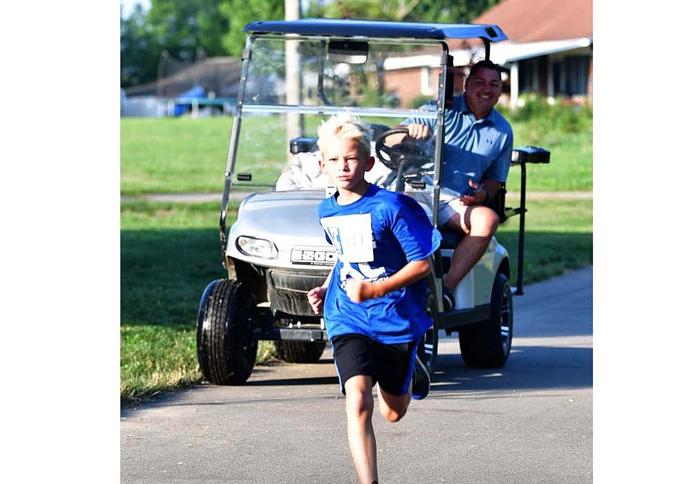 Isaiah Timmerman competes in the Run Jay County 2K race on Saturday morning. Timmerman earned the top time of 7 minutes, 39.34 seconds, and he hit a top speed of 14.6 miles per hour. (Special to The Commercial Review/Tracy Clark)