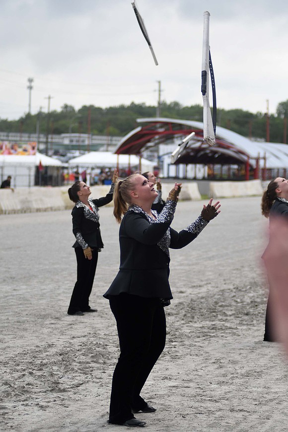 JCHS color guard member Madi Schweigel waits to catch her rifle. (The Commercial Review/Ray Cooney)