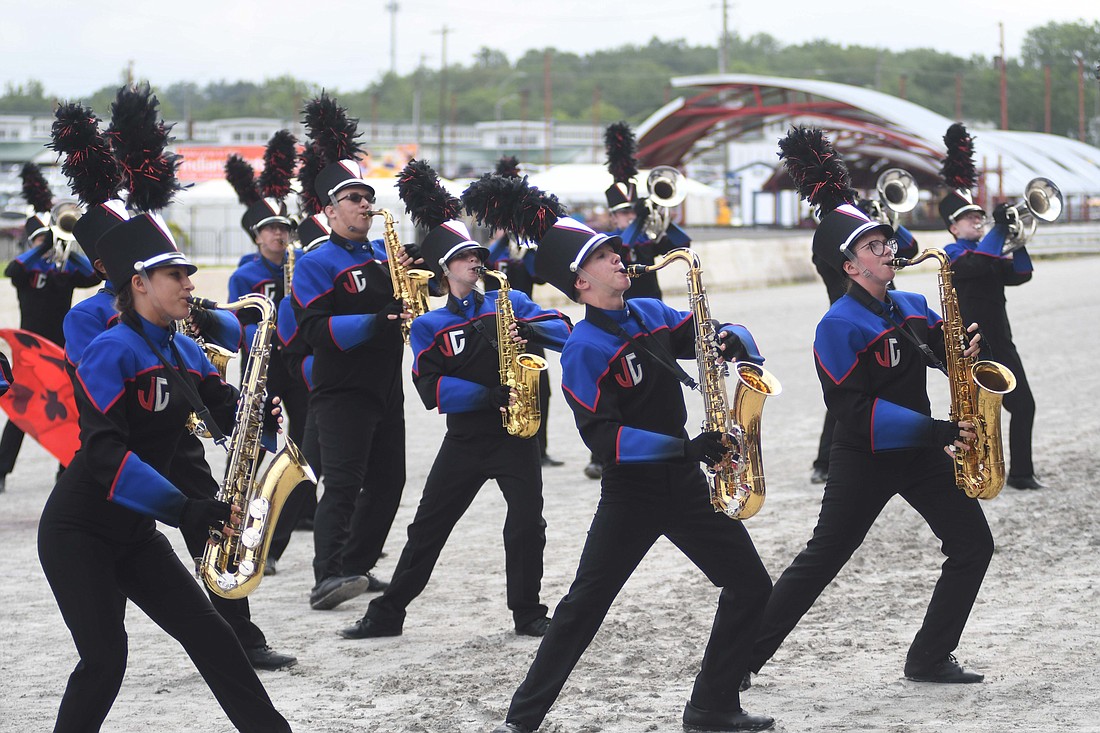 The Jay County High School Marching Patriots saxophone section dances Friday morning during their preliminary Indiana State Fair Band Day performance in Indianapolis. The band went on to a fifth-place finish, scoring 86.788 points. It trailed Muncie Central, Anderson, Kokomo and Richmond. (The Commercial Review/Ray Cooney)