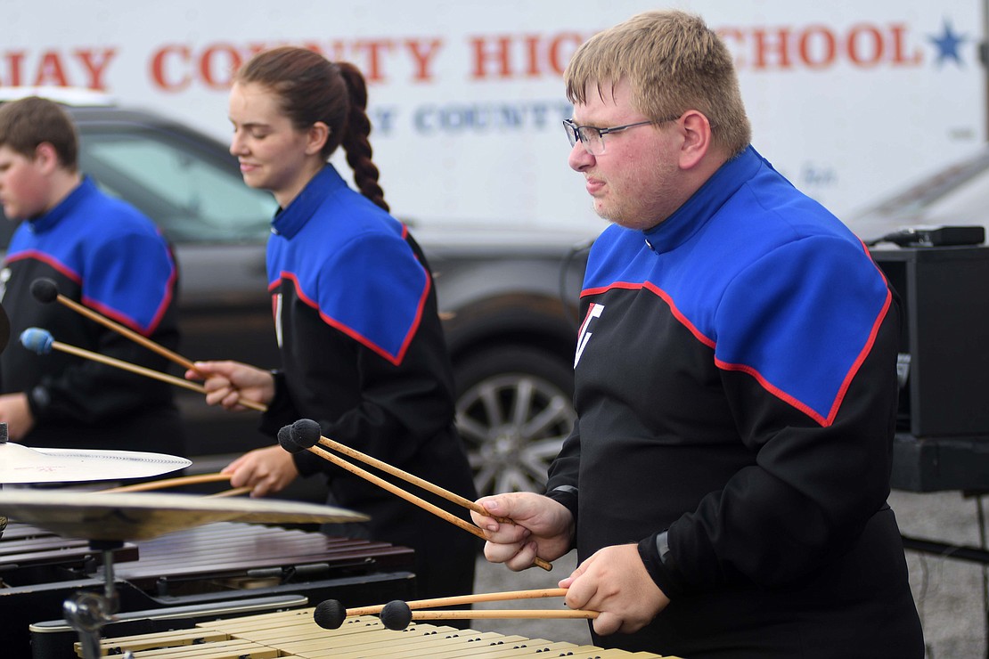 Trenton Franks and Keira Corwin of the front ensemble warm up ahead of the preliminary round Friday. (The Commercial Review/Ray Cooney)