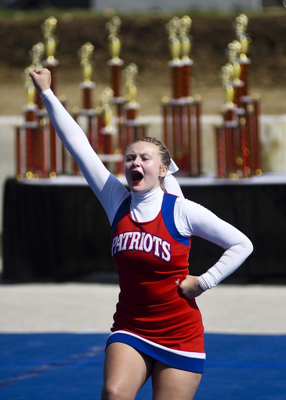 Jay County High School cheerleader Trinity Glassford yells Saturday during the Indiana State Fair competition. The Patriots finished in second place. (The Commercial Review/Ray Cooney)