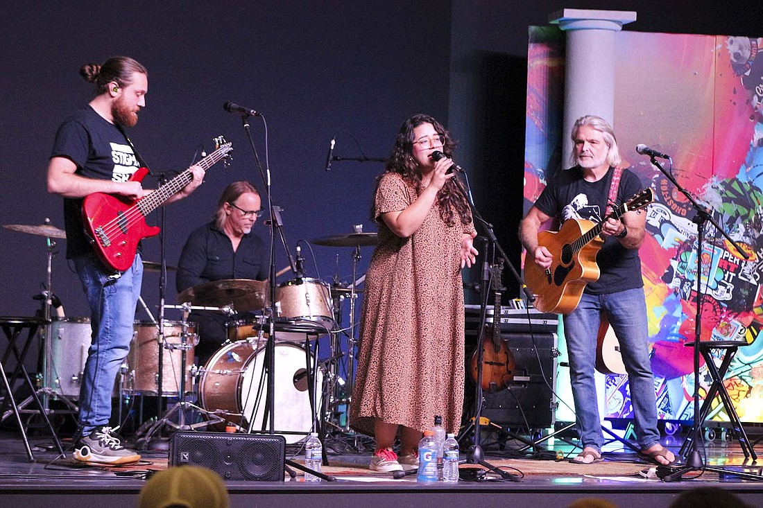 Frye Family Band members Jonny Frye, Eric Reynolds, Mane (Hernandez Ayes) Frye and Tom Frye perform Sunday at Christ Chapel Church in Fort Recovery. The performance served as a celebration for the group’s newly released album, “This is Your Victory.” (The Commercial Review/Bailey Cline)