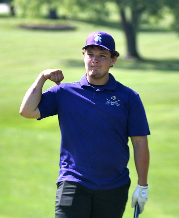 Fort Recovery High School senior Riley Grieshop flexes towards his teammates after sinking a 12-foot putt to make bogey on the 18th hole at Portland Golf Club on Thursday morning. Grieshop shot a 43 to help the Indians to a 171-208 win over the Misssissinawa Valley Blackhawks. (The Commercial Review/Andrew Balko)