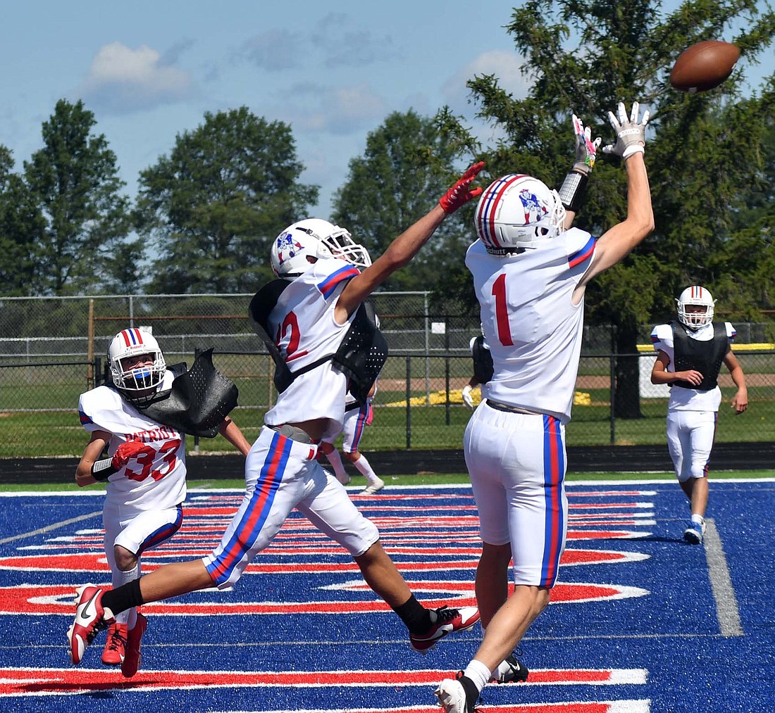 Ben Crouch, a senior receiver on the JCHS football team jumps up to catch a touchdown during the red and white scrimmage on Saturday morning. Crouch had three receptions last season totalling 15 yards. (The Commercial Review/Andrew Balko)