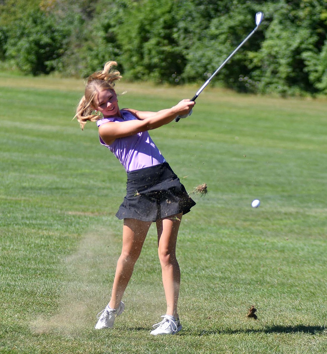 Georgia Wenning of Fort Recovery High School hits her iron on the sixth hole at Portland Golf Club on Monday morning. Wenning shot a 49 to help the Indians to a 197-221 victory over Marion Local. (The Commercial Review/Andrew Balko)