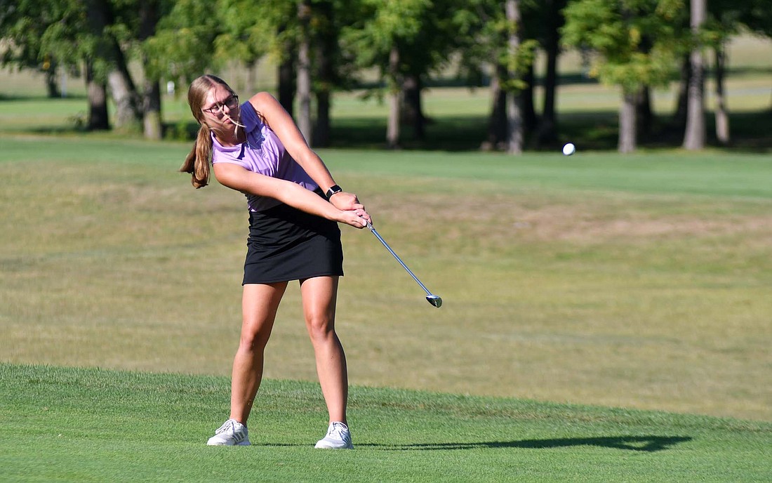 Mallory Evers of the Fort Recovery High School girls golf team chips onto the fifth green at Wabash Valley Golf Course on Tuesday. The junior provided Fort Recovery’s third score in the 199-212 victory over South Adams by shooting a 50. (The Commercial Review/Andrew Balko)