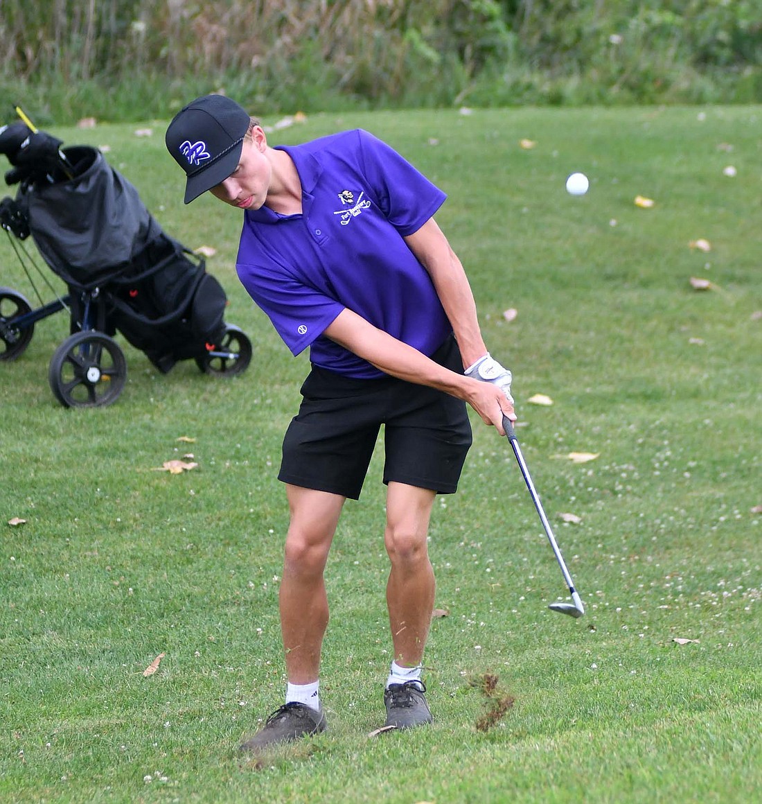 Fort Recovery High School junior Caleb Smith chips onto the 18th green at Portland Golf Club during the Indians’ golf match on Aug. 15. After struggling in that match, he returned to the scoring column on Monday with a 44 at Mercer County Elks. His score ended as the fourth-best for Fort Recovery as it beat New Bremen 164-183 to stay perfect in conference heading into a match against Minster. (The Commercial Review/Andrew Balko)