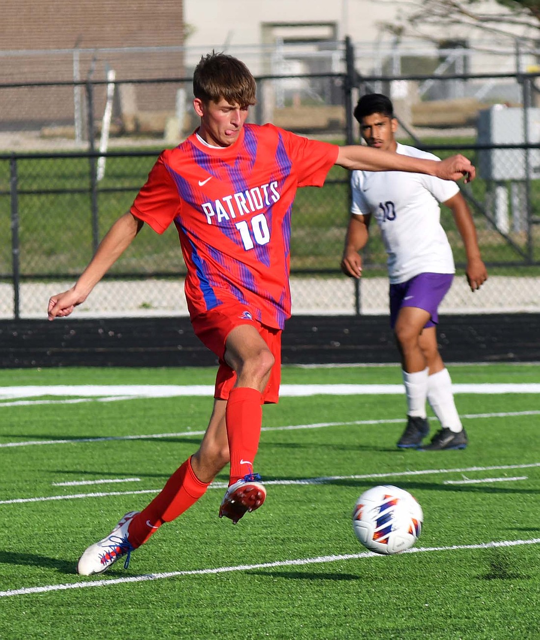 Midfielder Cayden Buckland of the Jay County High School boys soccer team moves into position to control a loose ball during the Patriots’ 1-0 win over Muncie Central on Tuesday. (The Commercial Review/Andrew Balko)