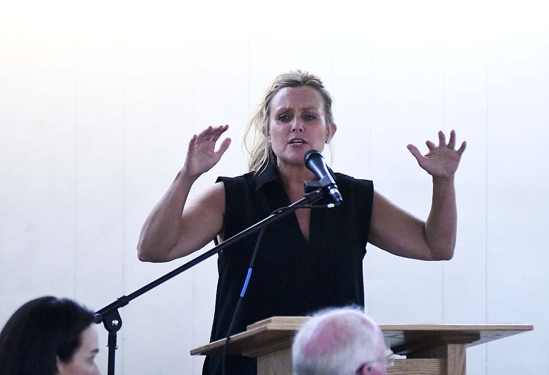 Democrat Jennifer McCormick, who is running for Indiana governor, gestures while speaking Saturday night during the Roosevelt Truman Dinner in Hartford City. McCormick, the former superintendent of Yorktown Schools, spoke extensively about supporting education. (The Commercial Review/Ray Cooney)